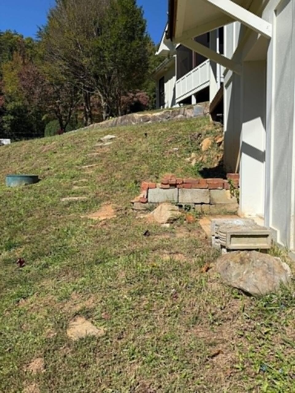 New retaining wall and fresh sod in a residential landscape